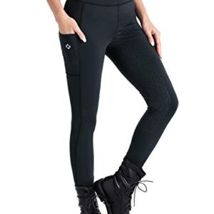 Dame reitet mit NAVISKIN Reitleggingen, die ein Silikonvollbesatz haben und eine Handytasche auf der Beinseite haben.