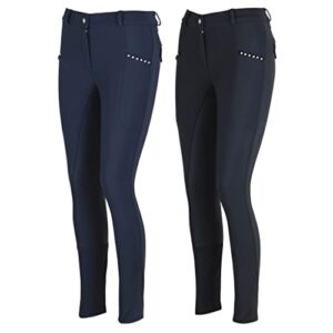 Dame in einer dunkelblauen Vollbesatzreithose mit zwei seitlichen Handytaschen und Silikon-Vollbesatz für optimalen Halt im Sattel.
