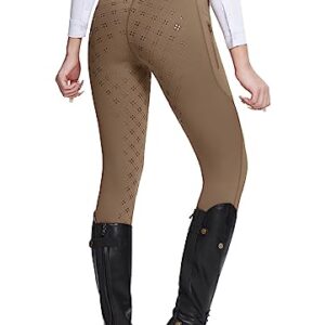 Dame trägt BALEAF Reithosen für Reitsport, Silikon Strumpfhosen mit Reißverschluss und Taschen für Komfort und Sicherheit beim Reiten.